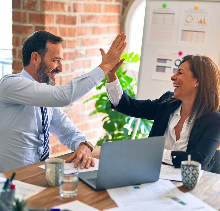 Two colleagues high-fiving